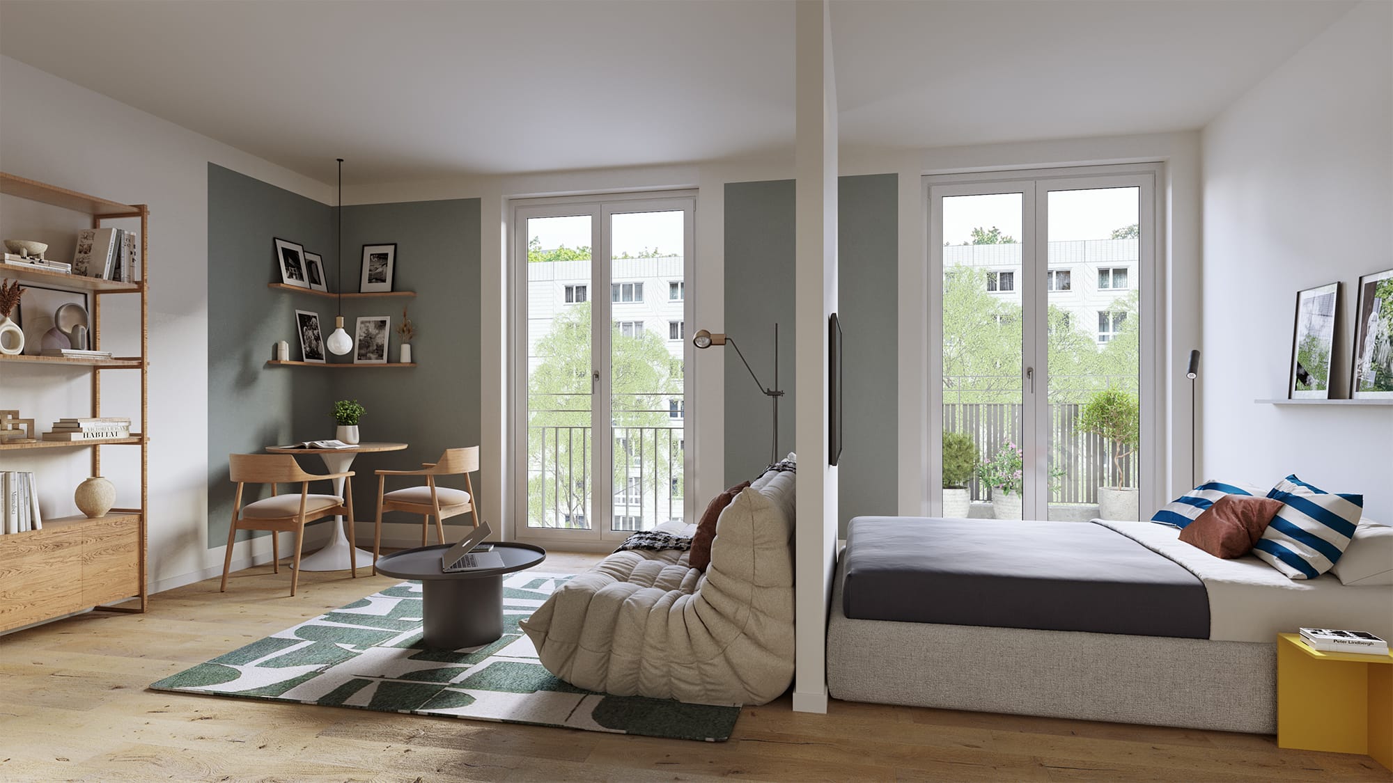 Studio-Apartment mit Bett, Loungesessel, Essecke und zwei bodentiefen Balkontüren